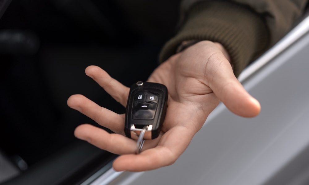 high-angle-hand-holding-car-key Locksmith